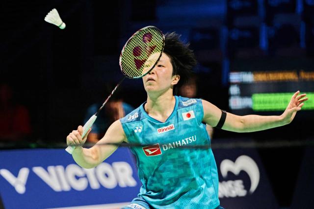 Akane Yamaguchi from Japan in action against Pornpawee Chochuwong from Thailand (unseen) in the women's singles quarterfinal at the Denmark Open in badminton at SJF Bank Arena in Odense on October 16, 2026. (Photo by Thomas Traasdahl / Ritzau Scanpix / AFP) / Denmark OUT