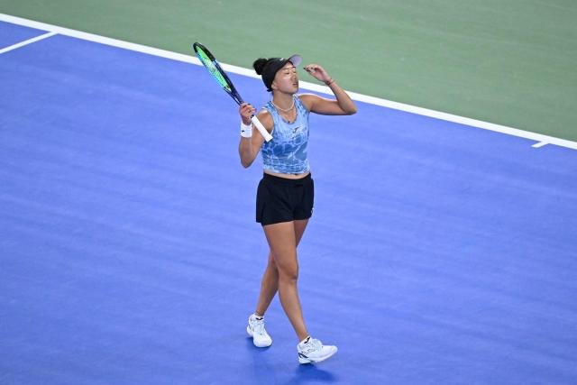 USA's Ann Li reacts after a point against Poland’s Iga Swiatek during their women’s singles quarter-final match at the Wuhan Open tennis tournament in Wuhan, China's Hubei province on October 16, 2026. (Photo by WANG Zhao / AFP)