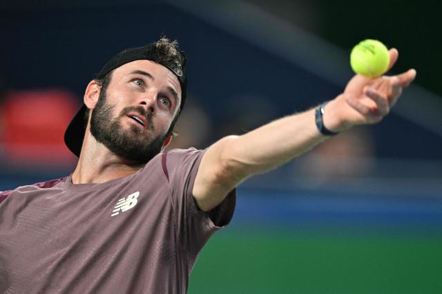 USA's Tommy Paul serves to Russia's Daniil Medvedev during their men's singles quarter-final match at the Shanghai Masters tennis tournament in Shanghai on October 16, 2026. (Photo by Hector RETAMAL / AFP)