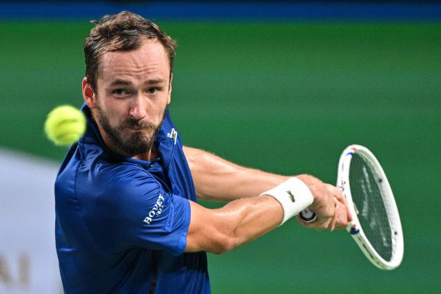 Russia's Daniil Medvedev hits a return to USA's Tommy Paul during their men's singles quarter-final match at the Shanghai Masters tennis tournament in Shanghai on October 16, 2026. (Photo by Hector RETAMAL / AFP)