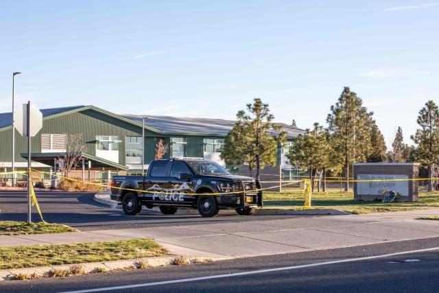 Police tape blocks access to Silver Rail Elementary School a day after a shooting at the school in Bend, Oregon, on October 16, 2026. Three children and one teacher were shot dead at an elementary school on October 15 in the northwestern US state of Oregon, police said, adding that the assailant was a 16-year-old who was killed by an armed bystander. (Photo by Payton Bruni / AFP)