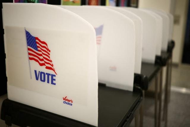 Voting booths are seen in the town hall in Bangor, Maine, during early midterm voting on October 16, 2026. Americans voting in the November 3 midterm elections will decide who controls Congress for the final two years of Donald Trump's presidency, along with dozens of governorships and thousands of state offices. (Photo by CHARLY TRIBALLEAU / AFP)