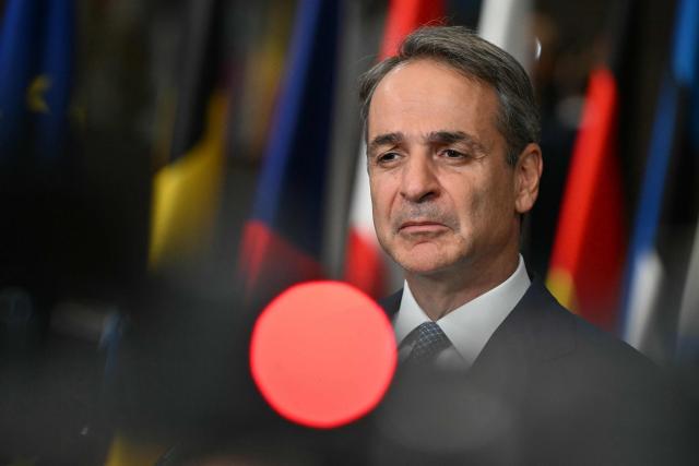Greece's Prime Minister Kyriakos Mitsotakis makes a doorstep statement at the end of a European Union summit at the EU headquarters in Brussels on October 16, 2026. EU leaders head on October 15, 2026 for their biggest clash yet over the bloc's next long-term budget, as they race to lock in a deal before next year's French presidential election. (Photo by NICOLAS TUCAT / AFP)