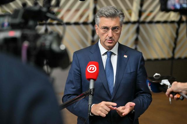 Croatia's Prime Minister Andrej Plenkovic makes a doorstep statement at the end of a European Union summit at the EU headquarters in Brussels on October 16, 2026. EU leaders head on October 15, 2026 for their biggest clash yet over the bloc's next long-term budget, as they race to lock in a deal before next year's French presidential election. (Photo by NICOLAS TUCAT / AFP)