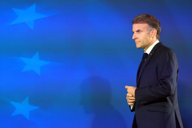 France's President Emmanuel Macron arrives to give a press conference at the end of a European Union summit at the EU headquarters in Brussels on October 16, 2026. EU leaders head on October 15, 2026 for their biggest clash yet over the bloc's next long-term budget, as they race to lock in a deal before next year's French presidential election. (Photo by Ludovic MARIN / AFP)