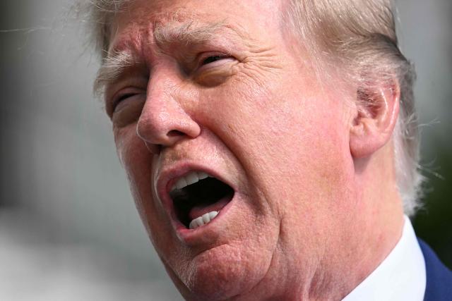 US President Donald Trump speaks to members of the press before boarding Marine One on the South Lawn of the White House in Washington, DC, on October 16, 2026. President Trump is travelling to Georgia and Kentucky for midterm campaign events. (Photo by Jim WATSON / AFP)