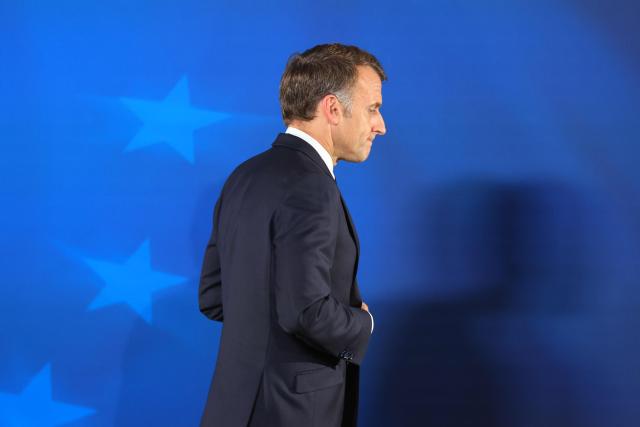 France's President Emmanuel Macron leaves at the end of a press conference at the end of a European Union summit at the EU headquarters in Brussels on October 16, 2026. EU leaders head on October 15, 2026 for their biggest clash yet over the bloc's next long-term budget, as they race to lock in a deal before next year's French presidential election. (Photo by Ludovic MARIN / AFP)