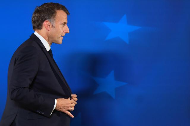 France's President Emmanuel Macron leaves at the end of a press conference at the end of a European Union summit at the EU headquarters in Brussels on October 16, 2026. EU leaders head on October 15, 2026 for their biggest clash yet over the bloc's next long-term budget, as they race to lock in a deal before next year's French presidential election. (Photo by Ludovic MARIN / AFP)