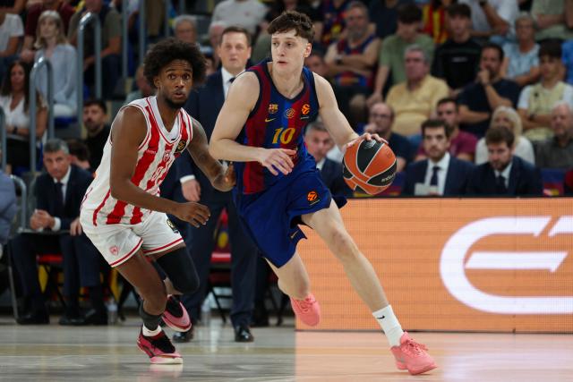 Barcelona's Italian guard #10 Augustin Ubal (R) dribbles pressured by Olympiacos' Dominican guard #08 Jean Montero during the EuroLeague basketball day 6 match between FC Barcelona and Olympiacos Pireus at the Palau Blaugrana arena in Barcelona on October 16, 2026. (Photo by Lluis GENE / AFP)