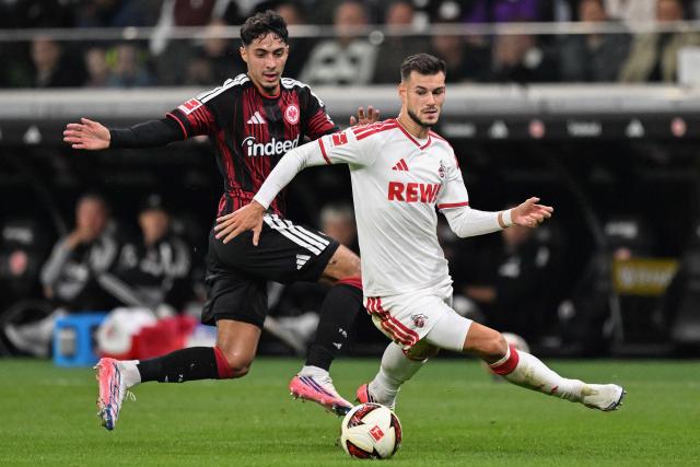 FC Cologne's German midfielder #05 Tom Krauss (R) and Frankfurt's Algerian midfielder #08 Fares Chaibi vie for the ball during the German first division Bundesliga football match between Eintracht Frankfurt and FC Cologne in Frankfurt am Main, western Germany, on October 16, 2026. (Photo by Kirill KUDRYAVTSEV / AFP) / DFL REGULATIONS PROHIBIT ANY USE OF PHOTOGRAPHS AS IMAGE SEQUENCES AND/OR QUASI-VIDEO