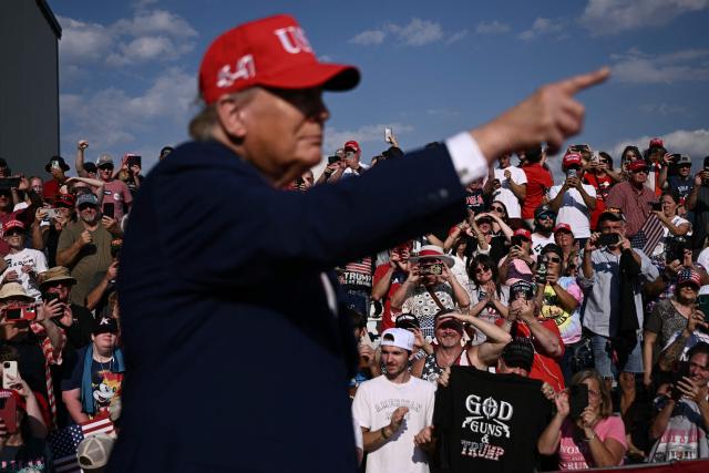 Supporters cheer as US President Donald Trump arrives to speak at a midterm campaign rally at Dalton Municipal Airport in Dalton, Georgia, on October 16, 2026. Trump is campaigning for US Representative Mike Collins for US Senate and Rick Jackson for governor. (Photo by Brendan SMIALOWSKI / AFP)