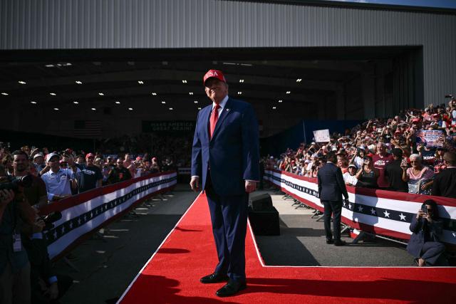 US President Donald Trump arrives to speak at a midterm campaign rally at Dalton Municipal Airport in Dalton, Georgia, on October 16, 2026. Trump is campaigning for US Representative Mike Collins for US Senate and Rick Jackson for governor. (Photo by Brendan SMIALOWSKI / AFP)