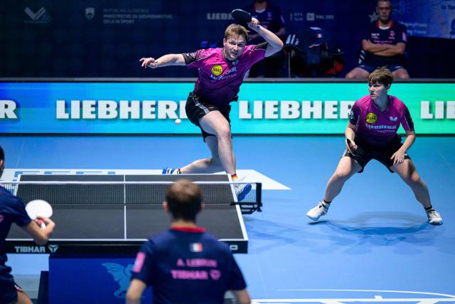 Germany’s Nina Mittelham (top R) and Benedikt Duda (top L) compete during the Mixed Doubles match of the 2026 ETTU European Individual Table Tennis Championships at the Arena Stozice in Ljubljana, Slovenia on October 16, 2026. (Photo by Jure Makovec / AFP)