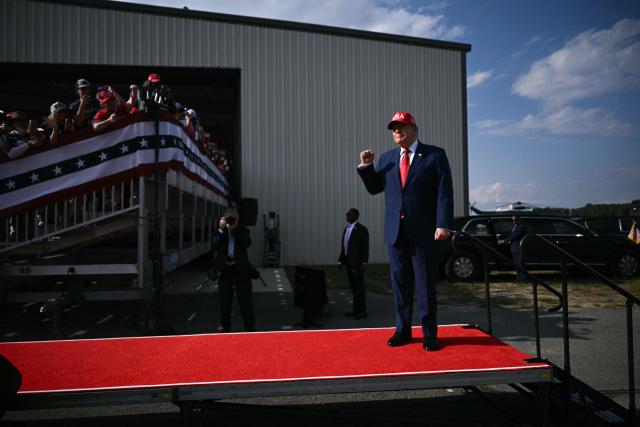 US President Donald Trump arrives to speak at a midterm campaign rally at Dalton Municipal Airport in Dalton, Georgia, on October 16, 2026. Trump is campaigning for US Representative Mike Collins for US Senate and Rick Jackson for governor. (Photo by Brendan SMIALOWSKI / AFP)