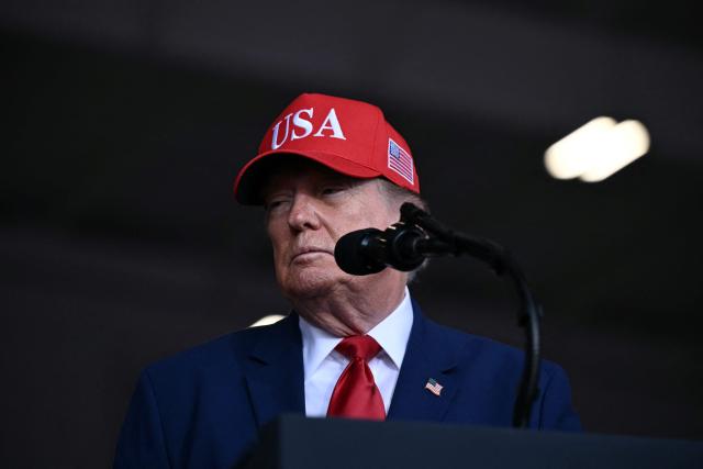 US President Donald Trump speaks at a midterm campaign rally at Dalton Municipal Airport in Dalton, Georgia, on October 16, 2026. Trump is campaigning for US Representative Mike Collins for US Senate and Rick Jackson for governor. (Photo by Brendan SMIALOWSKI / AFP)