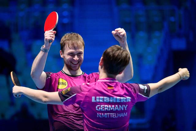 Germany’s Nina Mittelham (R) and Benedikt Duda celebrate after winning the Mixed Doubles final match of the 2026 ETTU European Individual Table Tennis Championships at the Arena Stozice in Ljubljana, Slovenia on October 16, 2026. (Photo by Jure Makovec / AFP)