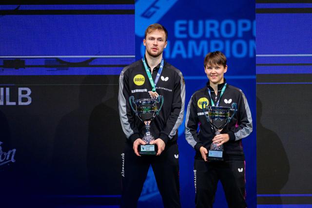 Germany’s Nina Mittelham (R) and Benedikt Duda pose for photos after winning the Mixed Doubles final match of the 2026 ETTU European Individual Table Tennis Championships at the Arena Stozice in Ljubljana, Slovenia on October 16, 2026. (Photo by Jure Makovec / AFP)