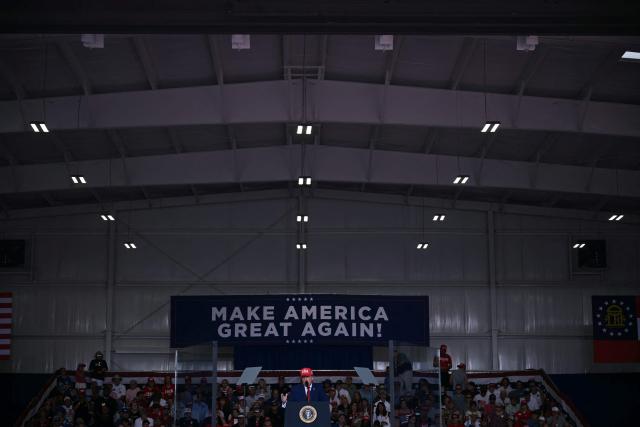 US President Donald Trump speaks at a midterm campaign rally at Dalton Municipal Airport in Dalton, Georgia, on October 16, 2026. Trump is campaigning for US Representative Mike Collins for US Senate and Rick Jackson for governor. (Photo by Brendan SMIALOWSKI / AFP)