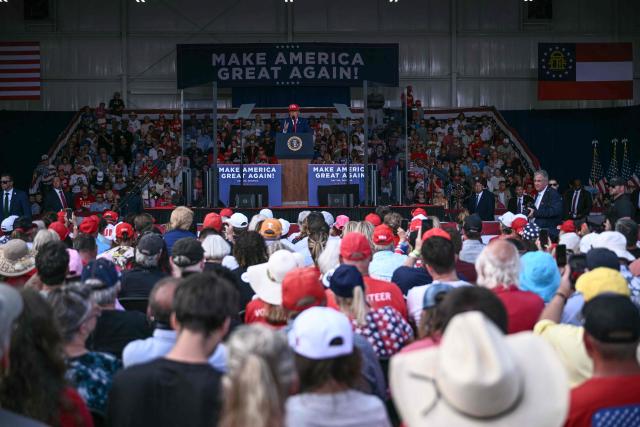 US President Donald Trump speaks at a midterm campaign rally at Dalton Municipal Airport in Dalton, Georgia, on October 16, 2026. Trump is campaigning for US Representative Mike Collins for US Senate and Rick Jackson for governor. (Photo by Brendan SMIALOWSKI / AFP)
