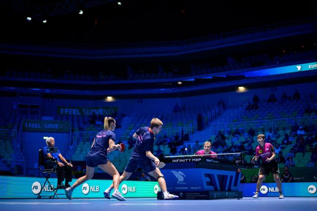 (From L) France’s Charlote Lutz and Alexis Lebrun compete against Germany’s Benedikt Duda and Nina Mittelham during the Mixed Doubles final match of the 2026 ETTU European Individual Table Tennis Championships at the Arena Stozice in Ljubljana, Slovenia on October 16, 2026. (Photo by Jure Makovec / AFP)