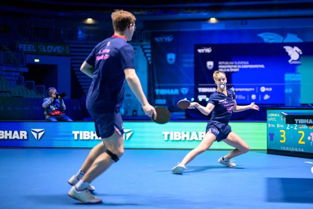 France’s Charlote Lutz (R) and Alexis Lebrun compete during the Mixed Doubles final match of the 2026 ETTU European Individual Table Tennis Championships at the Arena Stozice in Ljubljana, Slovenia on October 16, 2026. (Photo by Jure Makovec / AFP)