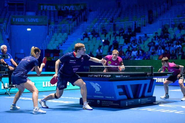 (From L) France’s Charlote Lutz and Alexis Lebrun compete  against Germany’s Benedikt Duda and Nina Mittelham during the Mixed Doubles final match of the 2026 ETTU European Individual Table Tennis Championships at the Arena Stozice in Ljubljana, Slovenia on October 16, 2026. (Photo by Jure Makovec / AFP)