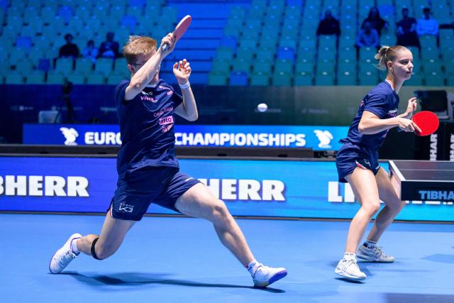 France’s Charlote Lutz (R) and Alexis Lebrun compete during the Mixed Doubles final match of the 2026 ETTU European Individual Table Tennis Championships at the Arena Stozice in Ljubljana, Slovenia on October 16, 2026. (Photo by Jure Makovec / AFP)