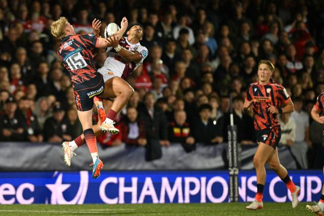 Gloucester's English full-back George Barton (L) and Bordeaux-Begles' French centre Yoram Moefana (2L) compete for a high ball during the European Champions Cup pool 3 rugby union match between Gloucester and Bordeaux-Begles at the Kingsholm Stadium in Gloucester, western England on October 16, 2026. (Photo by Oli SCARFF / AFP)