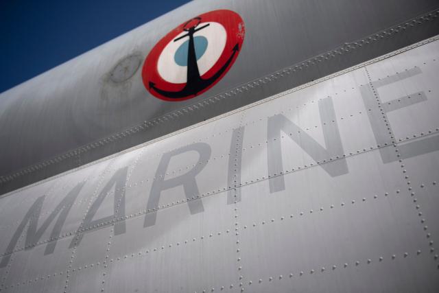 (FILES) This photograph shows the French navy logo taken from the French navy patrol airplane Atlantique 2 on mission above the Baltic Sea on June 16, 2022. The French Navy seized more than 8.6 tonnes of drugs, mainly cocaine, during a series of interdiction operations conducted in the Caribbean Sea and the Atlantic Ocean in early October 2026, AFP learned from authorities on October 16, 2026. (Photo by FRED TANNEAU / AFP)