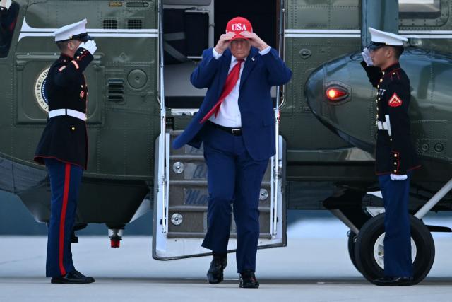 US President Donald Trump walks to board Air Force One at Dobbins Reserve Air Base in Marietta, Georgia on October 16, 2026. President Trump is campaigning for US Representative Mike Collins for US Senate and Rick Jackson for governor. (Photo by Brendan SMIALOWSKI / AFP)