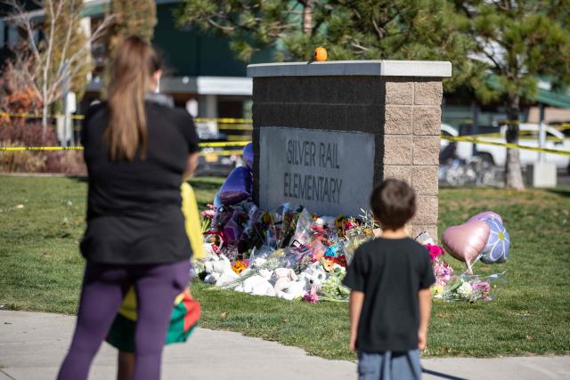People gather outside of Silver Rail Elementary School in Bend, Oregon, on October 16, 2026. Three children and one teacher were shot dead at an elementary school on October 15 in the northwestern US state of Oregon, police said, adding that the assailant was a 16-year-old who was killed by an armed bystander. (Photo by Payton Bruni / AFP)