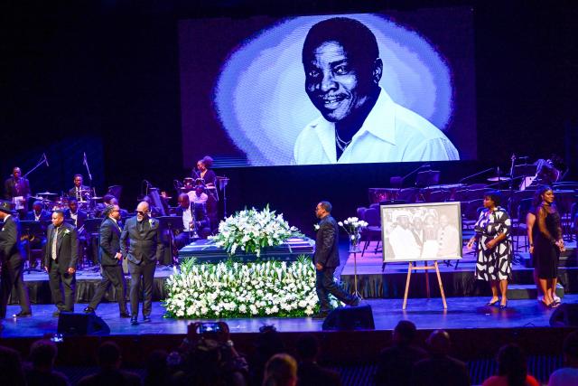 Artists and fans of singer Mighty Sparrow perform during funeral at an amphitheater in Port of Spain on October 16, 2026. A huge caravan brought hundreds of Trinidadians together on Friday to bid farewell with music and merrymaking to Mighty Sparrow, the legendary singer-songwriter who died in September and who brought calypso from the Caribbean island to the rest of the world. (Photo by Robert TAYLOR / AFP)