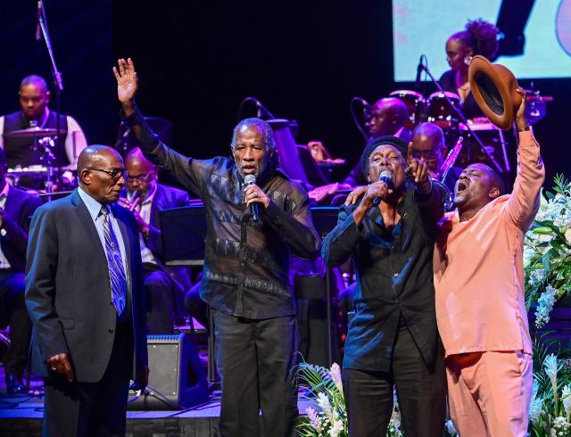 Artists and fans of singer Mighty Sparrow perform during funeral at an amphitheater in Port of Spain on October 16, 2026. A huge caravan brought hundreds of Trinidadians together on Friday to bid farewell with music and merrymaking to Mighty Sparrow, the legendary singer-songwriter who died in September and who brought calypso from the Caribbean island to the rest of the world. (Photo by Robert TAYLOR / AFP)