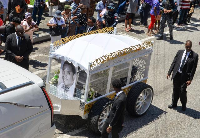 Fans of the singer Mighty Sparrow father during a funeral procession in Port of Spain on October 16, 2026. A huge caravan brought hundreds of Trinidadians together on Friday to bid farewell with music and merrymaking to Mighty Sparrow, the legendary singer-songwriter who died in September and who brought calypso from the Caribbean island to the rest of the world. (Photo by Robert Taylor / AFP)