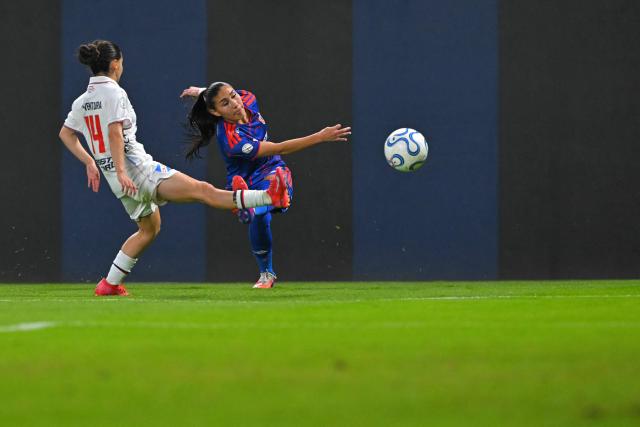 Nacional's  #14 Martina Ventura and Universidad de Chile's defender #2 Gabriela Garcia fight for the ball during the 2026 Women's Copa Libertadores Group D football match between Uruguay's Nacional and Chile's Universidad de Chile at the Rodrigo Paz Delgado Stadium in Quito on October 16, 2026. (Photo by Rodrigo BUENDIA / AFP)