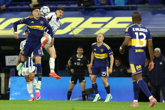 Boca Juniors' defender #06 Rodrigo Battaglia (L) and Talleres' forward #09 Agustin Alvarez fight for the ball during the Argentine Professional League 2026 Clausura tournament football match between Boca Juniors and Talleres de Cordoba at La Bombonera stadium in Buenos Aires on October 16, 2026. (Photo by Alejandro PAGNI / AFP)