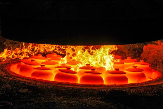 Yingjing black sand pottery is fired at a sandware factory in Yingjing County, Ya'an, in southwestern China's Sichuan province, on October 16, 2026. (Photo by CN-STR / AFP) / China OUT