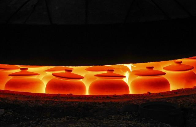 Yingjing black sand pottery is fired at a sandware factory in Yingjing County, Ya'an, in southwestern China's Sichuan province, on October 16, 2026. (Photo by CN-STR / AFP) / China OUT
