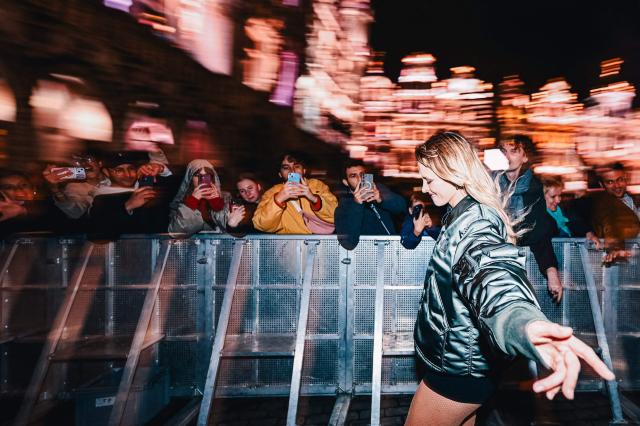 Belgian singer Angele performs during the "Angele Instinct Release Party", a surprise party organised to celebrate the release of her new album "Instinct" at Grand Place square, central Brussels,on October 16, 2026. (Photo by EMILE WINDAL / Belga / AFP) / Belgium OUT