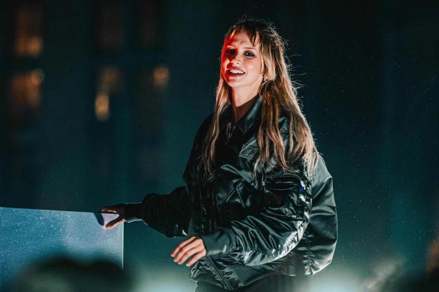 Belgian singer Angele performs during the "Angele Instinct Release Party", a surprise party organised to celebrate the release of her new album "Instinct" at Grand Place square, central Brussels,on October 16, 2026. (Photo by EMILE WINDAL / Belga / AFP) / Belgium OUT