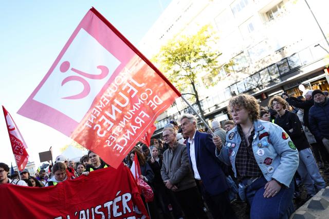 Communist Party (PCF) candidate in France's 2027 presidential election Fabien Roussel (C) attends a demonstration to protest against the "high cost of living", in Valenciennes, northern France, on October 17, 2026 as part of a nationwide call for mobilisation bringing together various groups expressing their anger: former "Yellow Vests", secondary school and university students, climate activists and even farmers. After weeks of student protests, France faces broader, nationwide demonstrations on October 17, 2026 over the cost of living, setting up a potentially fraught six months heading into a presidential election. A police source told AFP that authorities estimated nearly 200,000 people could take part, with 40,000 in Paris. (Photo by Sameer AL-DOUMY / AFP)