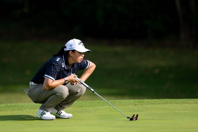 China's Yin Ruoning lines up a putt during the Buick LPGA Shanghai golf tournament in Shanghai on October 17, 2026. (Photo by CN-STR / AFP) / China OUT
