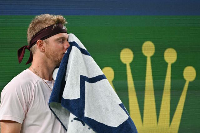 Spain's Alejandro Davidovich Fokina wipes his face between points against Germany's Alexander Zverev during their men's singles semi-final match at the Shanghai Masters tennis tournament in Shanghai on October 17, 2026. (Photo by Hector RETAMAL / AFP)