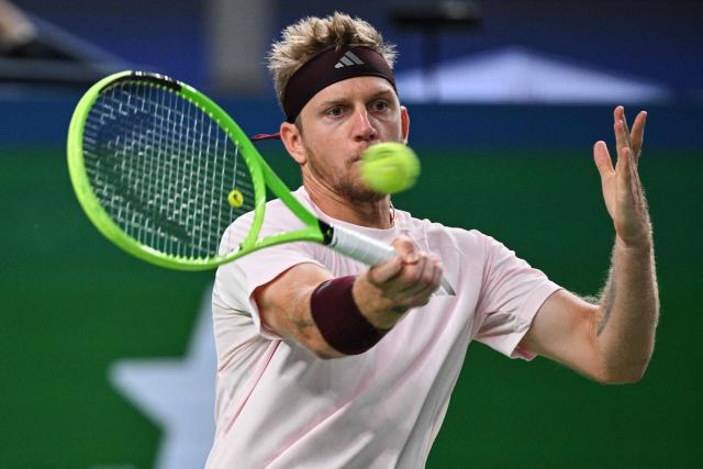 Spain's Alejandro Davidovich Fokina hits a return to Germany's Alexander Zverev during their men's singles semi-final match at the Shanghai Masters tennis tournament in Shanghai on October 17, 2026. (Photo by Hector RETAMAL / AFP)