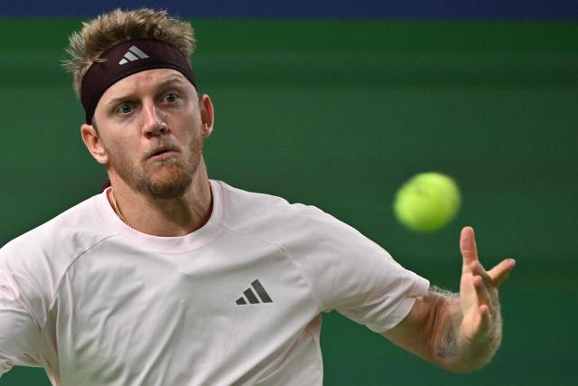 Spain's Alejandro Davidovich Fokina hits a return to Germany's Alexander Zverev during their men's singles semi-final match at the Shanghai Masters tennis tournament in Shanghai on October 17, 2026. (Photo by Hector RETAMAL / AFP)