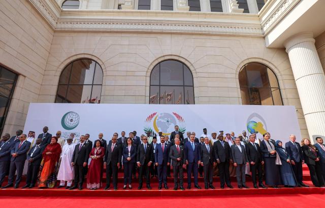Delegates pose for the family photo during the 52nd session of the Organisation of Islamic Cooperation (OIC) in Baghdad on October 17, 2026. (Photo by AHMAD AL-RUBAYE / AFP)