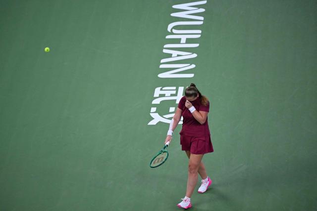 Latvia's Jelena Ostapenko reacts after a point against Sonay Kartal during their women's singles semi-final match at the Wuhan Open tennis tournament in Wuhan, China's Hubei province on October 17, 2026. (Photo by WANG Zhao / AFP)