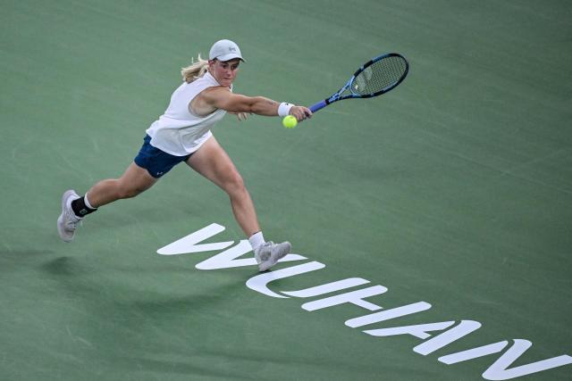 Britain's Sonay Kartal hits a return to Latvia's Jelena Ostapenko during their women's singles semi-final match at the Wuhan Open tennis tournament in Wuhan, China's Hubei province on October 17, 2026. (Photo by WANG Zhao / AFP)