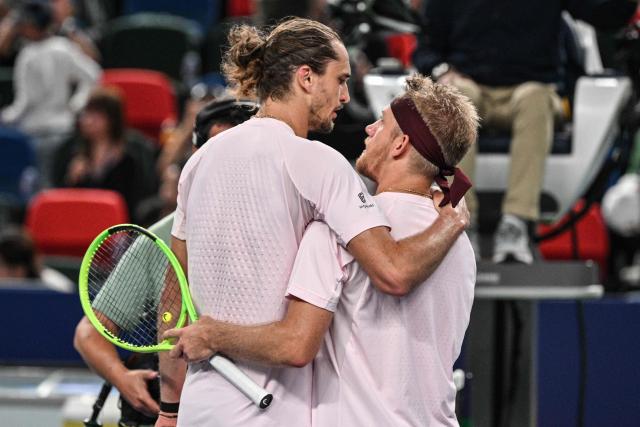 Spain's Alejandro Davidovich Fokina (R) speaks with Germany's Alexander Zverev after their men's singles semi-final match at the Shanghai Masters tennis tournament in Shanghai on October 17, 2026. (Photo by Hector RETAMAL / AFP)