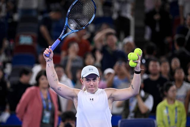 Britain's Sonay Kartal prepares to throw balls as she attends an interactive session after her win against Latvia's Jelena Ostapenko during their women's singles semifinal match at the Wuhan Open tennis tournament in Wuhan, China's Hubei province on October 17, 2026. (Photo by WANG Zhao / AFP)